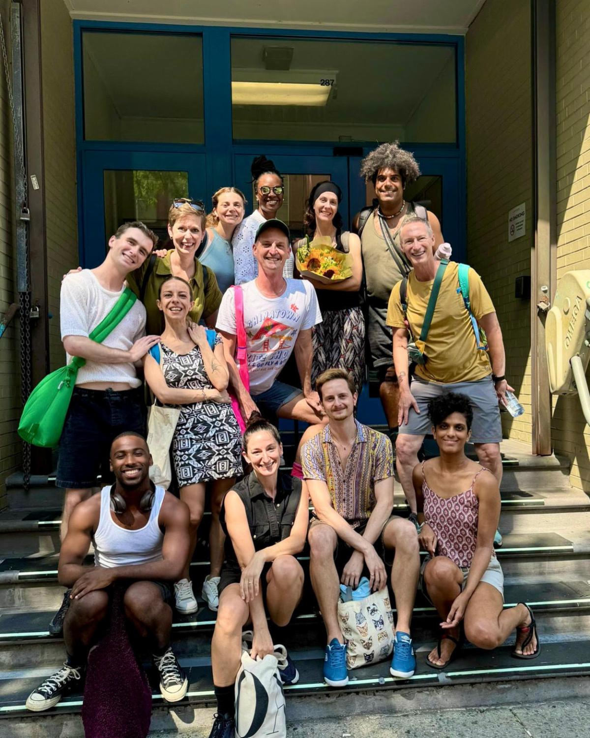 A group of people posing for a photo

Description automatically generated