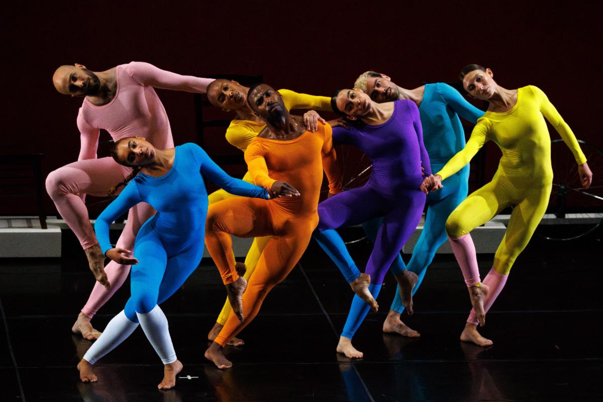 A group of dancers in different colors

Description automatically generated